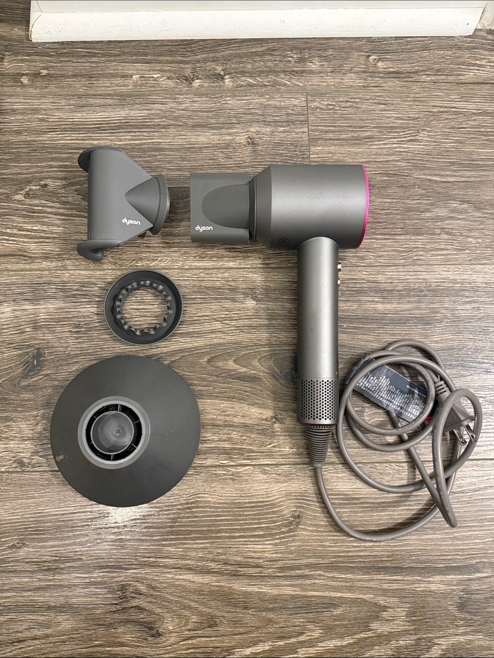 Dyson Hair Dryer in Gray with Pink Accent Ring and Magnetic Attachments